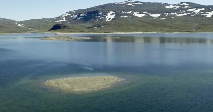Aerial view of fell landscape at lake Guolasjavri reservoir in summer, Birtavarre, Troms og Finnmark, Norway.