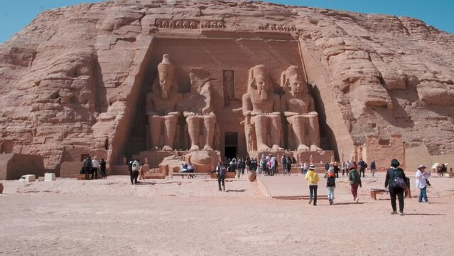 The Great Temple of Ramesses II in Abu Simbel , Egypt with four colossal, 20 m statues, each representing Ramesses II seated on a throne and wearing the double crown of Upper and Lower Egypt.
