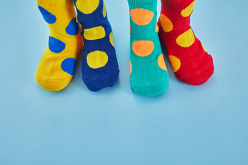 World Down syndrome day background. Legs with different socks as symbol of down syndrome