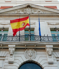 Official flag of Spain on the governmental building in Madrid, Spanish capital. Vertical photo