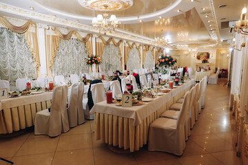 Decorated wedding banquet hall in classic style. Restaurant interior for banquet, wedding deco