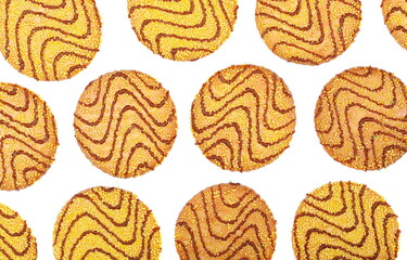 Cookies with milk chocolate drizzle, yellow  sprinkles and butter isolated on white, top view