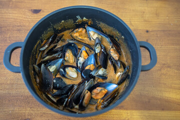 Pot with mussels and sauce