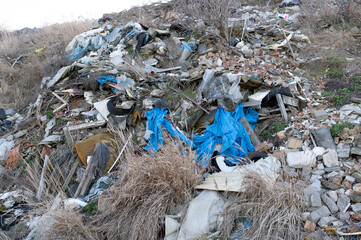 Waste and mess in the nature, recycling, earth day, hill full of waste
