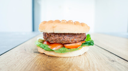 Tasty hamburger on blurred background