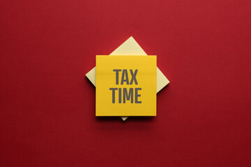 Tax Time text on adhesive note paper