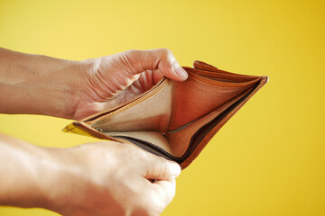 Man hand open an empty wallet with copy space.