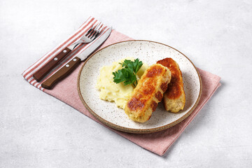 Cordon bleu with mashed potatoes served with parsley