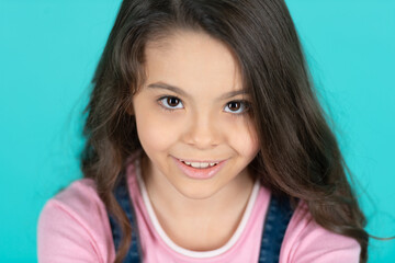 Fototapeta premium portrait of smiling teen girl on background. photo portrait of teen girl.