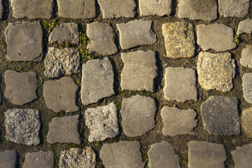 Abstract background of old cobblestone close up.