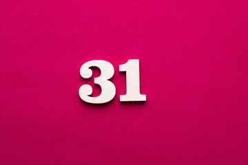 Number 31 - White wooden number on rhodamine red background