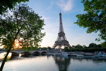 Fototapeta na wymiar Paris Eiffel Tower and river Seine with sunrise in Paris, France. Eiffel Tower is one of the most iconic landmarks of Paris.