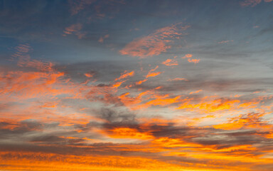 Colorful orange clouds at sunset time.
