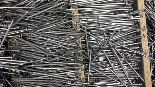 Long nails in the store on the counter.