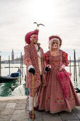 Costumed carnival participants and revellers mingle with tourists, visitors and locals as the carnival weekend gets into full swing in the streets and squares of Venice.