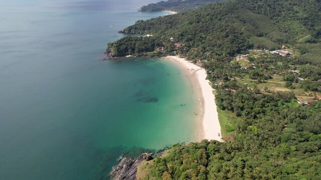 Orbital aerial footage of Khlong Chak beach on sunny day. Ko Lanta island, Krabi Province, Thailand.