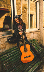 teenage woman with guitar