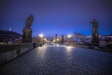 Obraz premium Charles Bridge, Prague at dramatic evening, Czech Republic, with night lighting