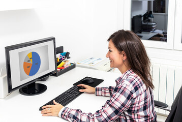 Mature Woman Businesswoman In Office Using Business Computer At Desk