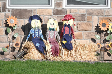 Three Scarecrows on Bale