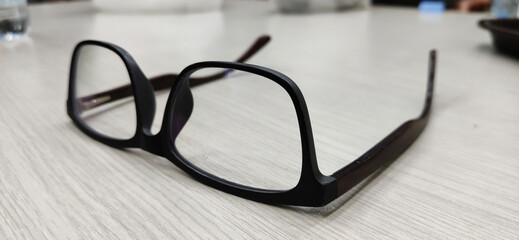 Eyeglasses that are lying in the counter after wear by the person who owns them