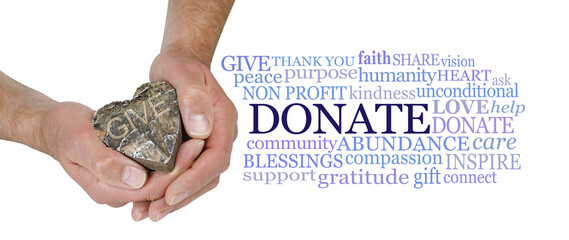 Words associated with charitable donations - male hands holding a wooden heart engraved with 'GIVE'...