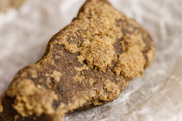 Detail of medical marijuana extraction hash cannabis pollen hashish, texture closeup