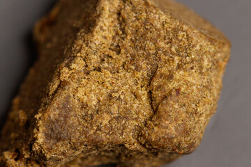 Detail of medical marijuana extraction hash cannabis pollen hashish, texture closeup