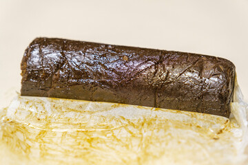 Indian Manali Charas, high quality resin hashish on a white background. Medical marijuana extraction hash cannabis pollen oil