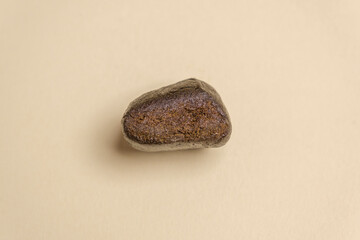 A piece of high quality hashish isolated on a white background. Medical marijuana extraction hash...