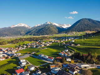 Aerial view Oberperfuss town in Tirol Austria by drone. Alps mountains.