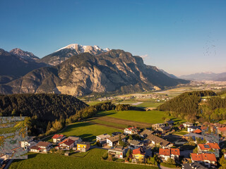 Aerial view Oberperfuss town in Tirol Austria by drone. Alps mountains.