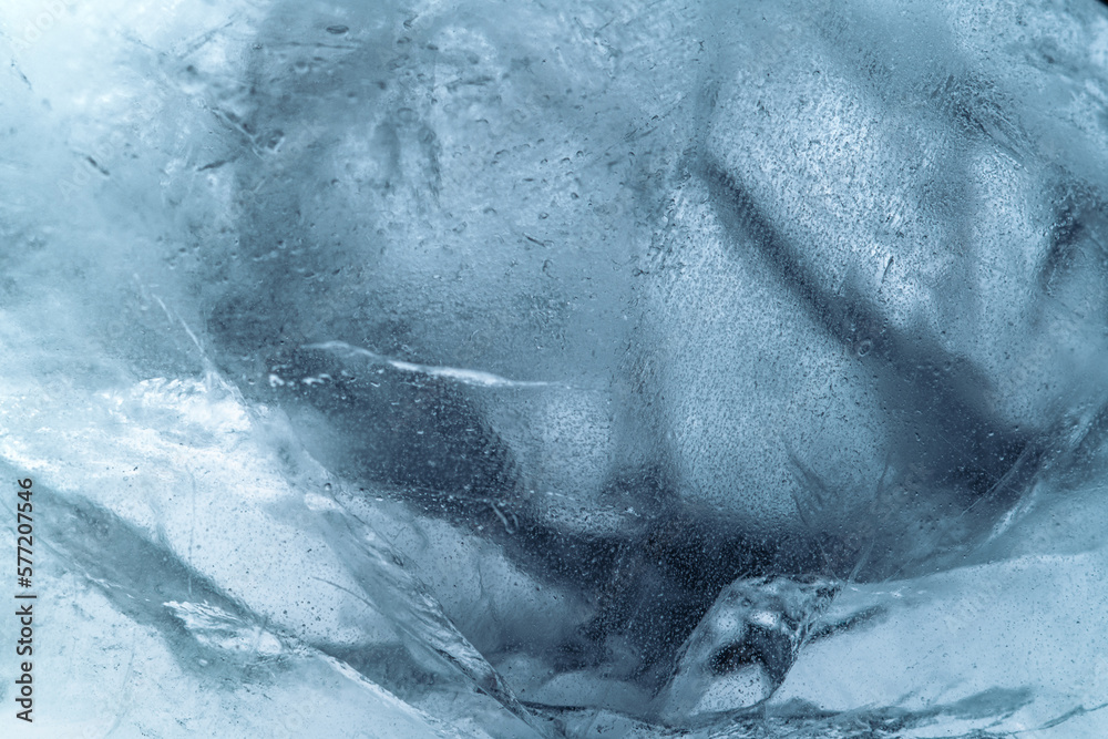 Wall mural abstract ice background. blue background with cracks on the ice surface