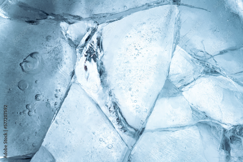 Wall mural abstract ice background. blue background with cracks on the ice surface
