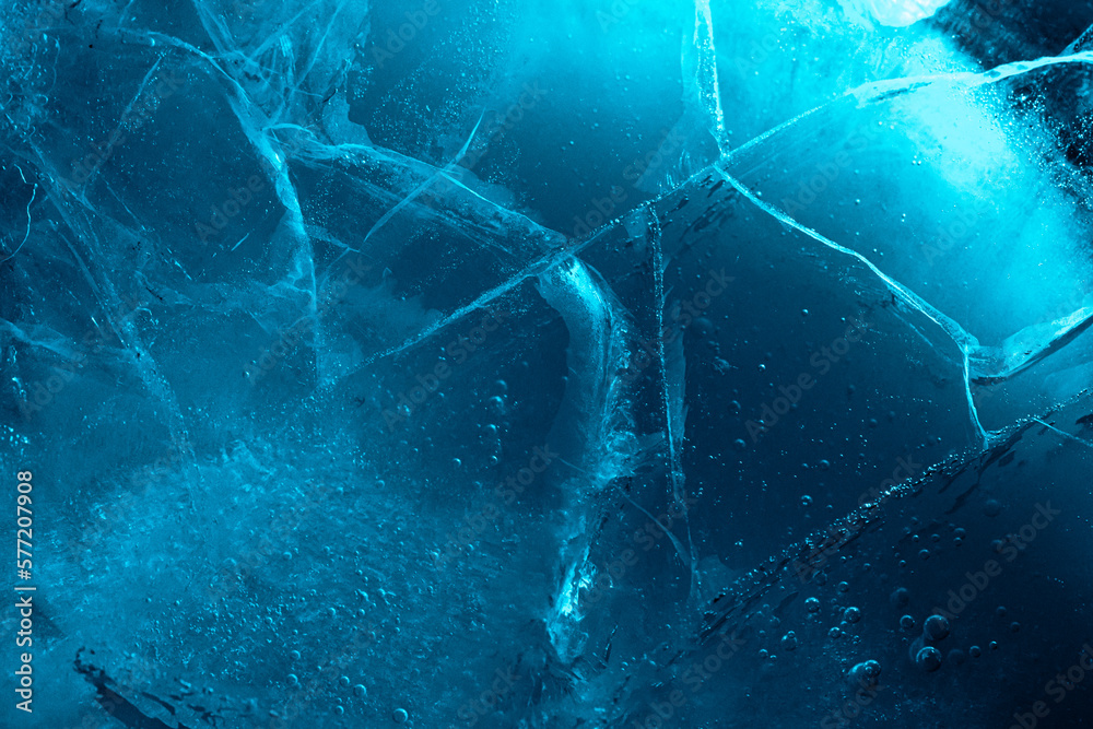 Wall mural abstract ice background. blue background with cracks on the ice surface