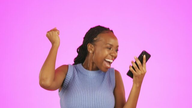 Black woman, phone and dancing in celebration for winning, discount or sale against a pink studio background. Excited African female isolated with smartphone celebrating in happy dance for good news