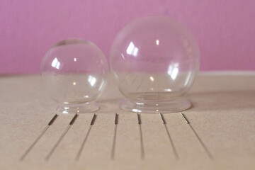 Seven acupuncture needles and two suckers to practice Chinese medicine, alternative therapies in the west.