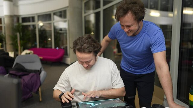 twin brothers study work together using a neural network, the brothers work with a neural network, program, work with a 3D model on a graphics tablet