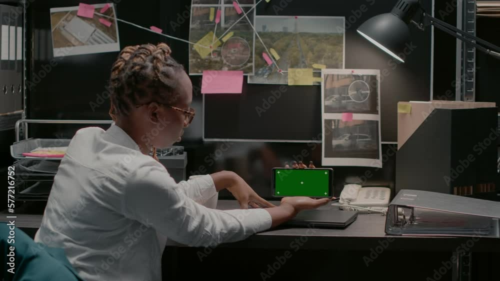 Wall mural young inspector using greenscreen in archive office space, examining chroma key display and conducti