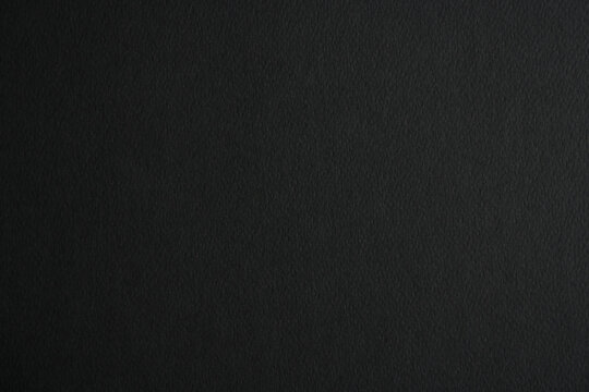 Black paper texture background. Black blank page

