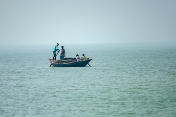 11th February, 2023, Sundarban, West Bengal, India: A fisher man family going for fishing with their country boat at Sundarban Tiger Reserve.
