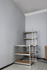 Office room with white walls and metal storage shelves