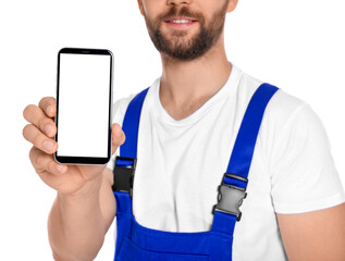 Professional repairman in uniform showing smartphone on white background, closeup
