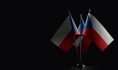 Small national flags of the Czechia on a black background