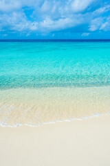 white sand beach with turquoise water in Carribbean