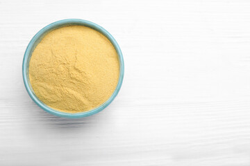 Beer yeast powder on white wooden table, top view. Space for text