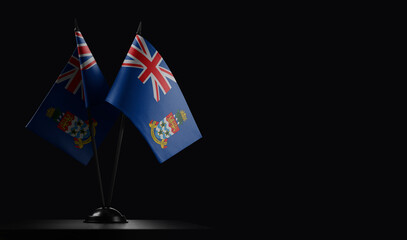 Small national flags of the Cayman Islands on a black background