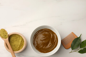Flat lay composition with henna powder and cream on white marble table, space for text. Natural hair coloring