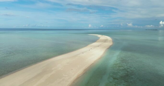 Sandy beach with crystal clear water in the tropics. Timba Timba islet. Tun Sakaran Marine Park. Borneo, Sabah, Malaysia.