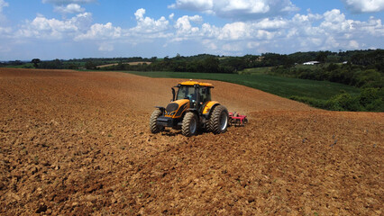 Aerial view of a tractor working in the field